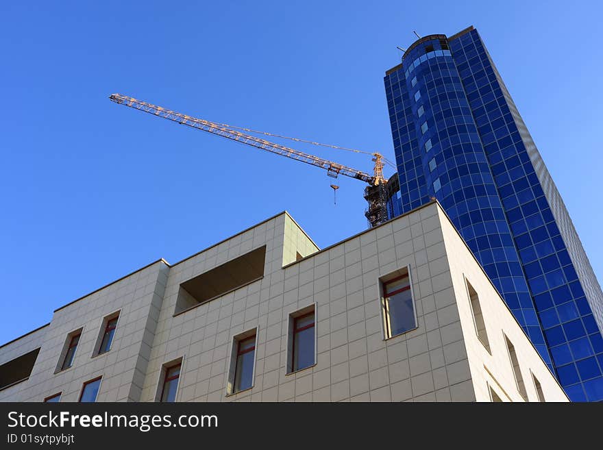 Building of modern office buildings against the dark blue sky