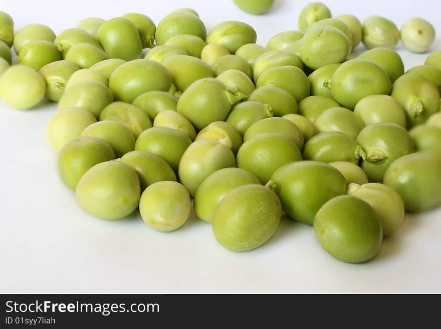 Pile of green peas photographed close up