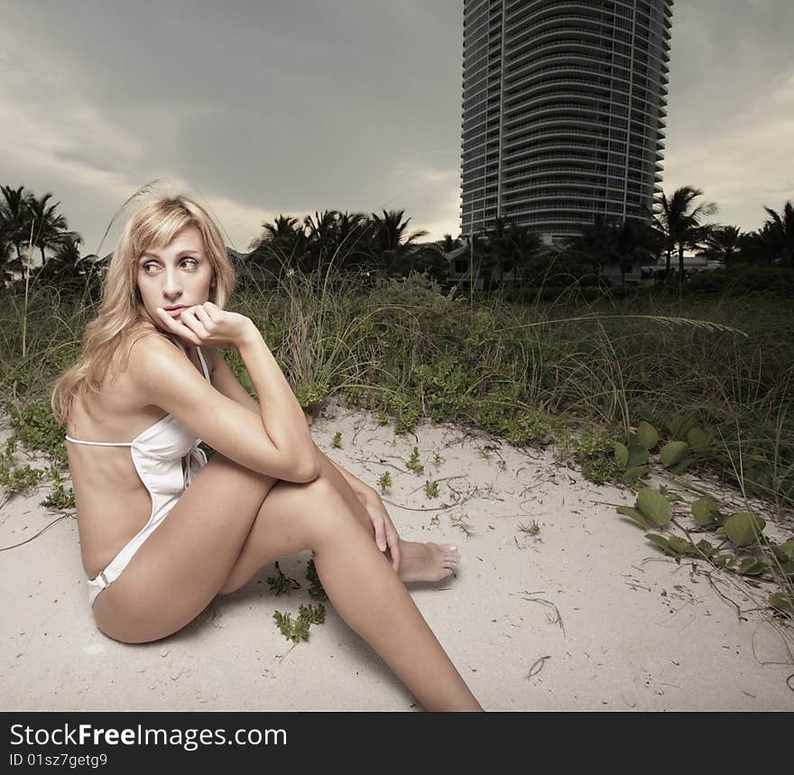 Beautiful young female laying in the beach dunes. Beautiful young female laying in the beach dunes