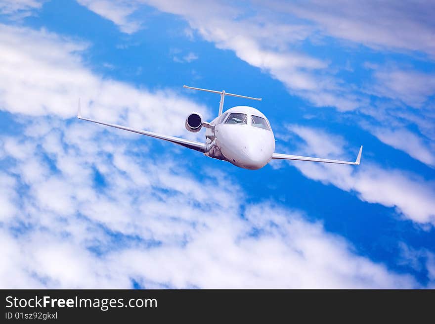 Airplane in air on blue sky