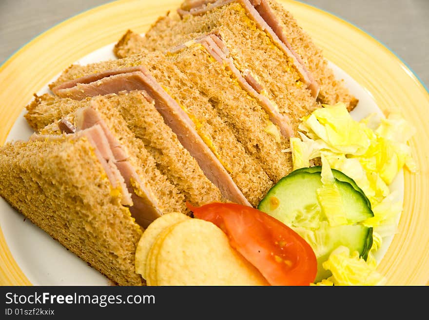 Fresh ham  with English mustard, lettuce and wholemeal brown bread served with  tomato, cucumber and potato crisps. Fresh ham  with English mustard, lettuce and wholemeal brown bread served with  tomato, cucumber and potato crisps.