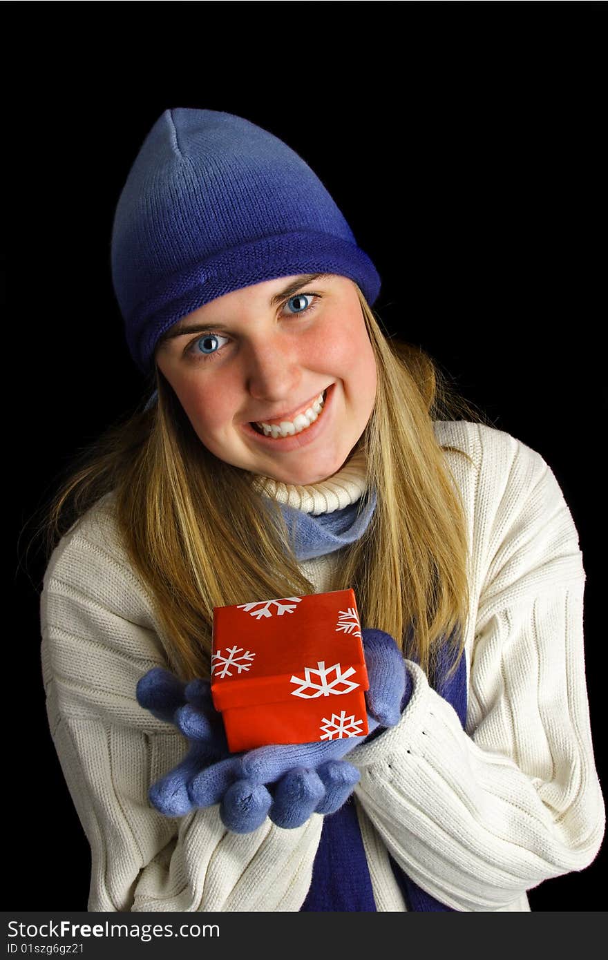 An attractive young lady presents a gift. An attractive young lady presents a gift.