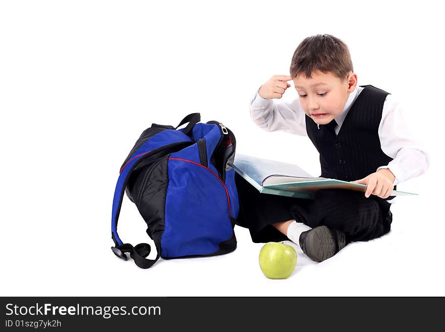 Schoolboy with book and apple