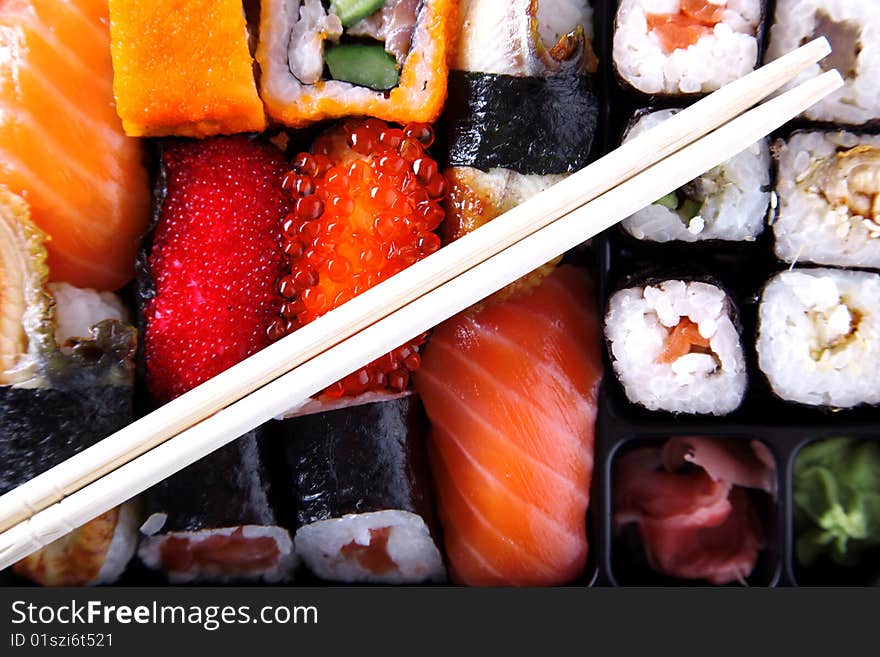 Japanese traditional sushi and wooden chopsticks