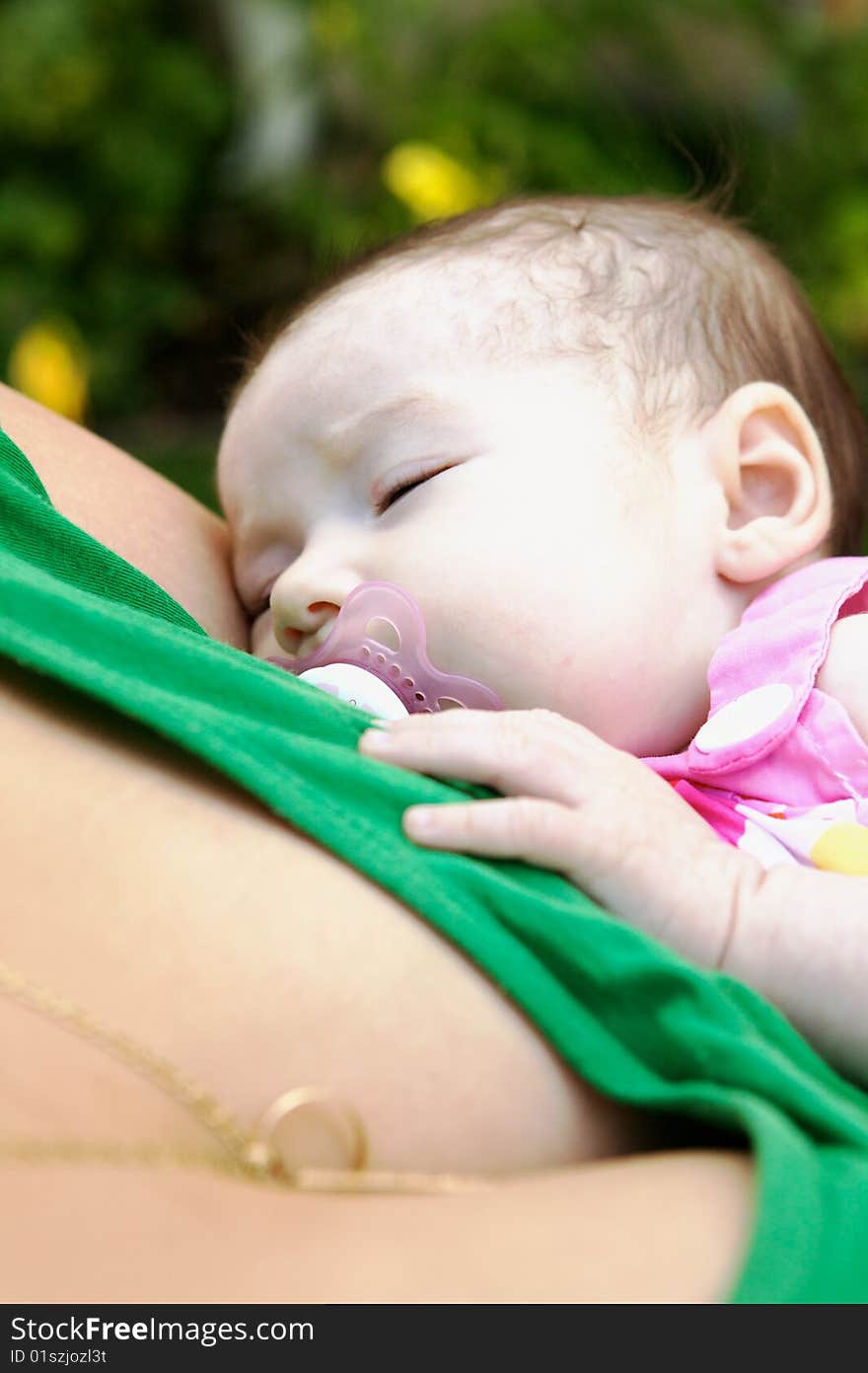 Baby Being Held By Mother