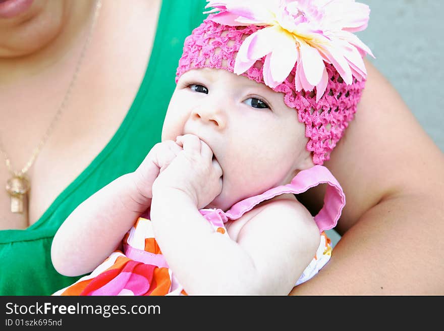 An adorable baby making a funny face at camera. An adorable baby making a funny face at camera