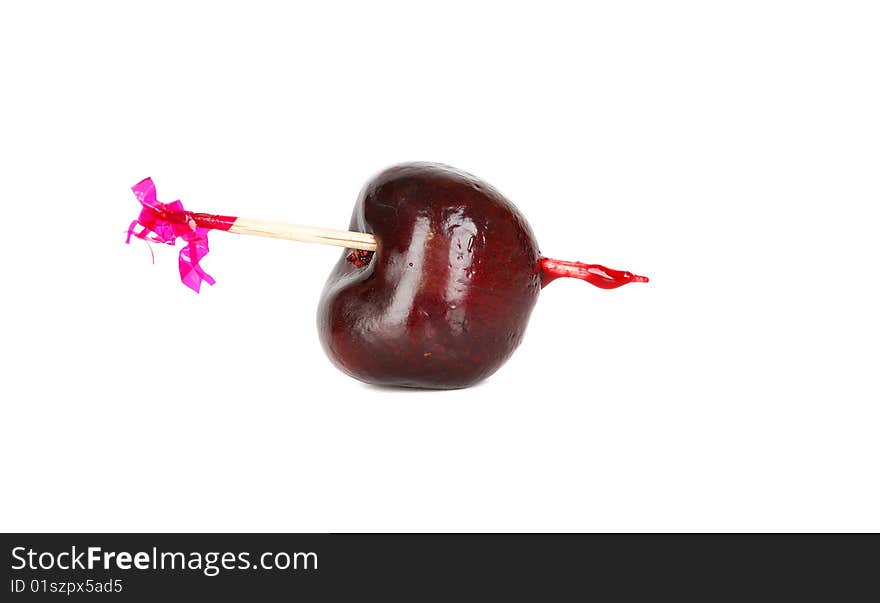 Black fresh ripe one cherry on the wood pick isolated on the hate background. Black fresh ripe one cherry on the wood pick isolated on the hate background.