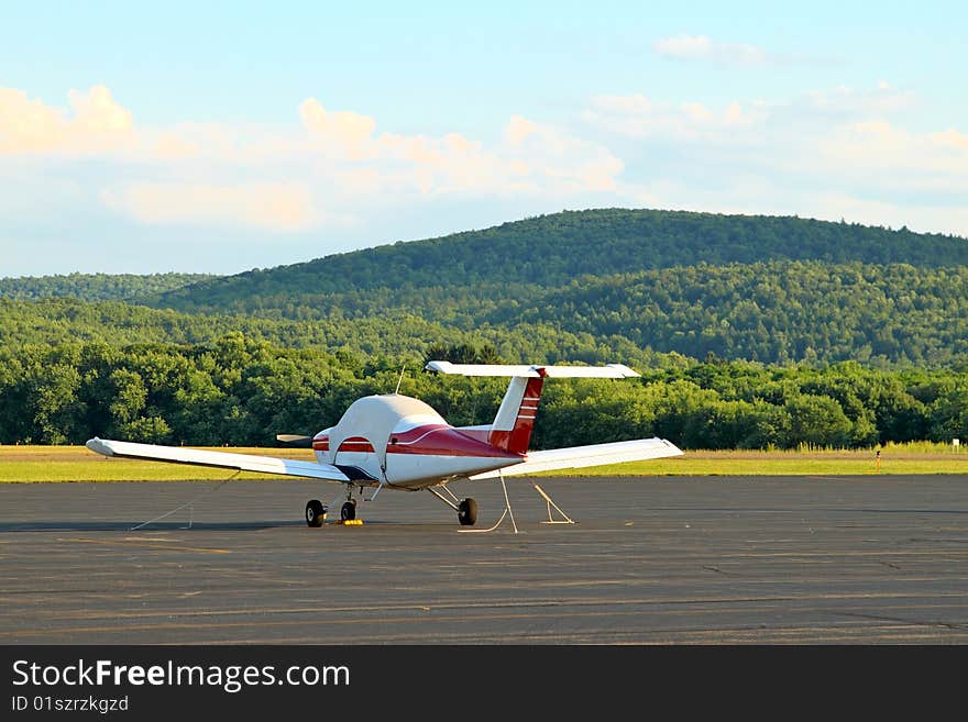 Single engine aircraft sits on the ramp. Single engine aircraft sits on the ramp.