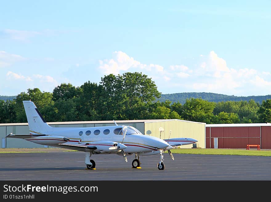 Twin engine aircraft sits on the ramp. Twin engine aircraft sits on the ramp.