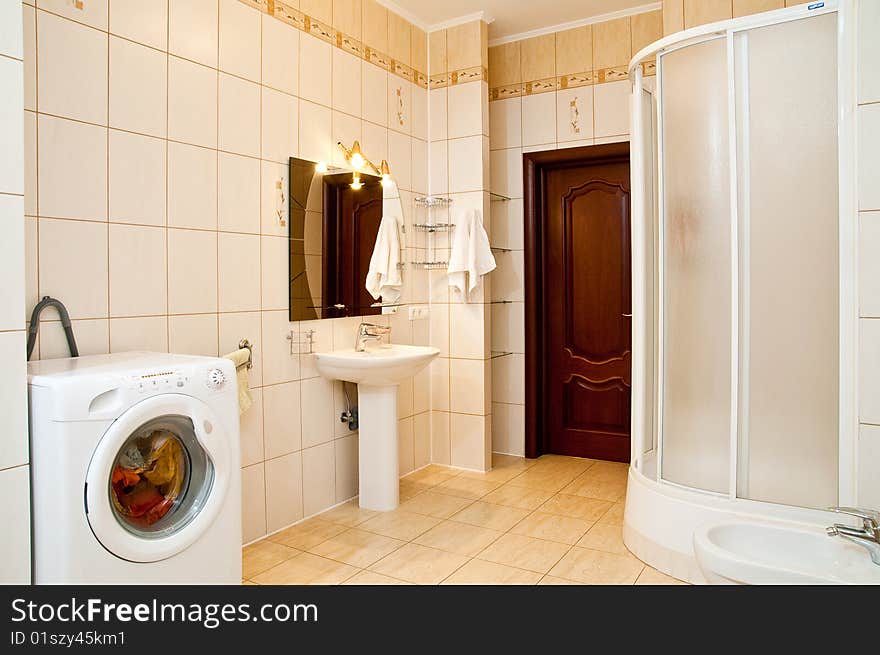 Lamp and mirror on a wall of bathroom