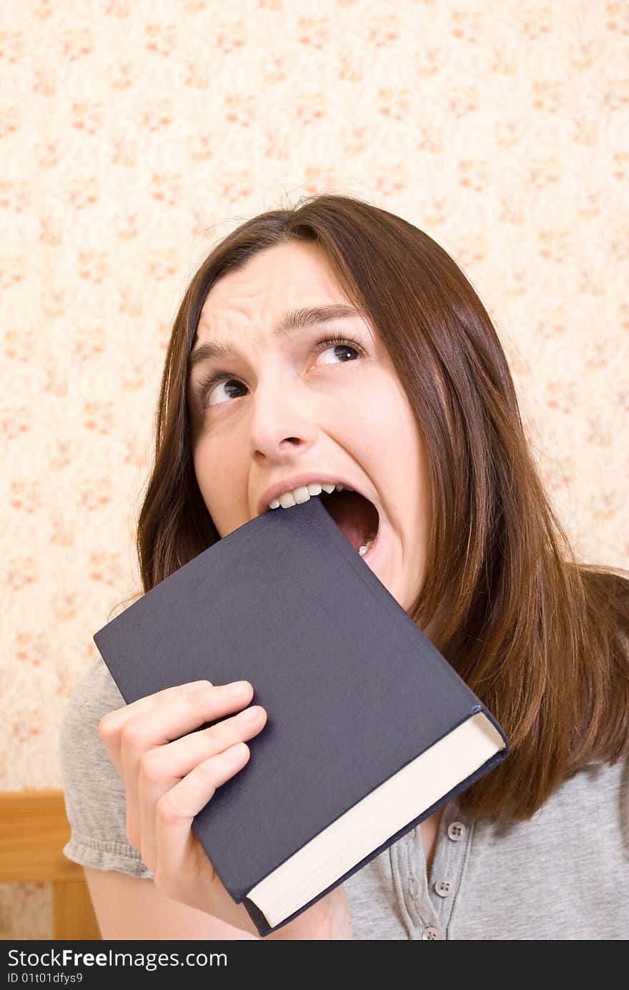 Young attractive woman with book