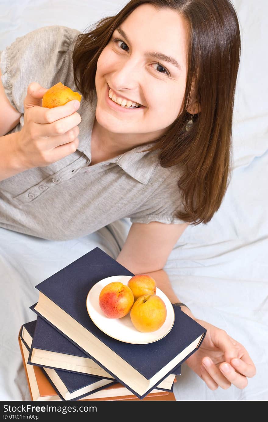 Portrait of young woman with  peach. Portrait of young woman with  peach