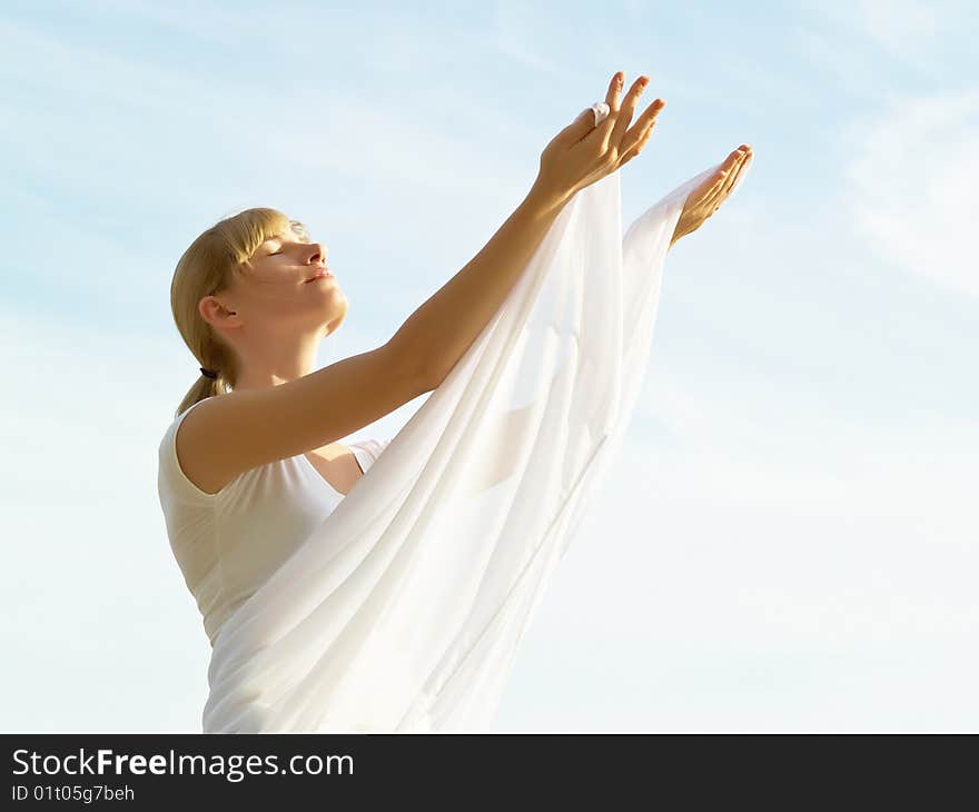 Session of a relaxation on a background of the years sky of the girl in white