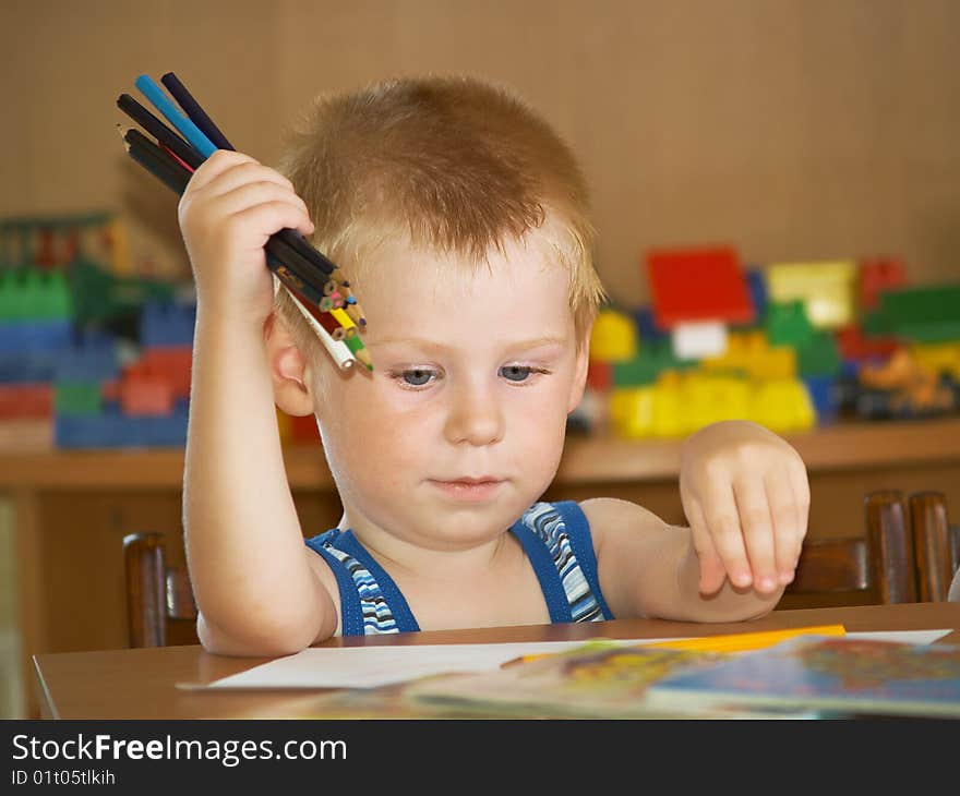 The boy of 2 years is engaged in a children's room