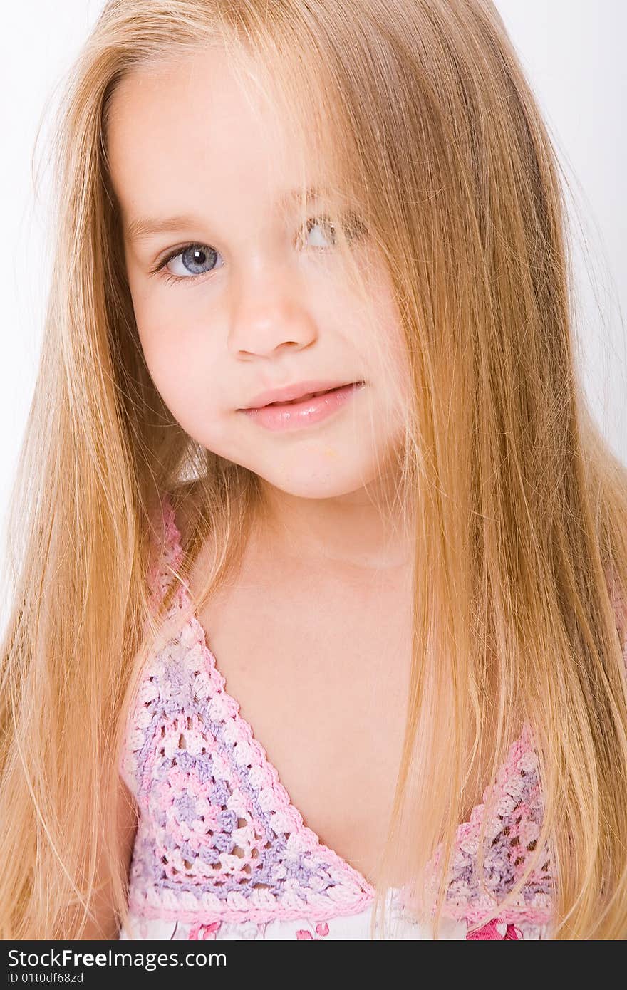 Beautiful little girl with long blonde hair