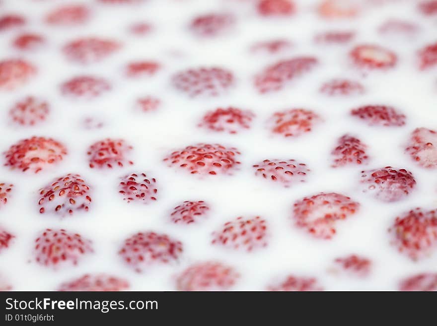 Strawberry in milk, close up