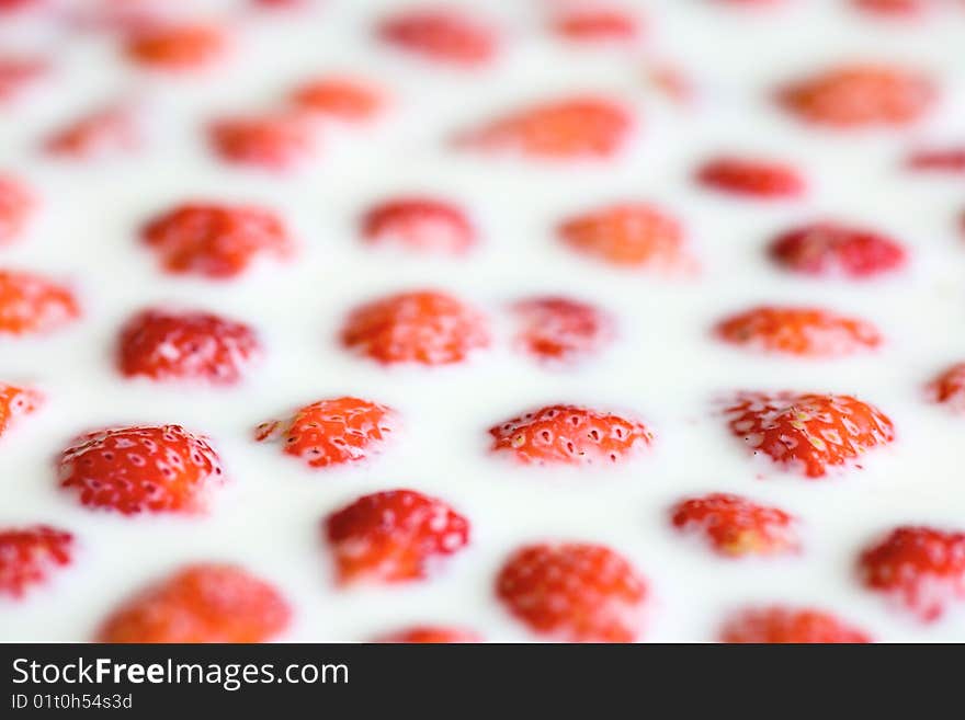 Strawberry in milk, close up