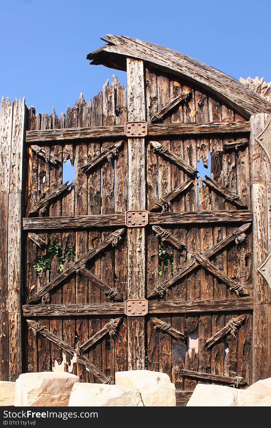 Wooden door isolated against the blue sky. Wooden door isolated against the blue sky.