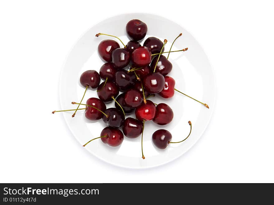 Ceramic white plate with red charries on white. Ceramic white plate with red charries on white