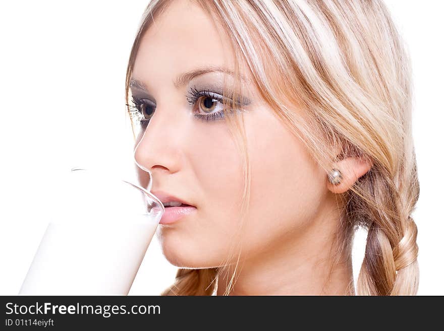 Beautiful woman drinking milk