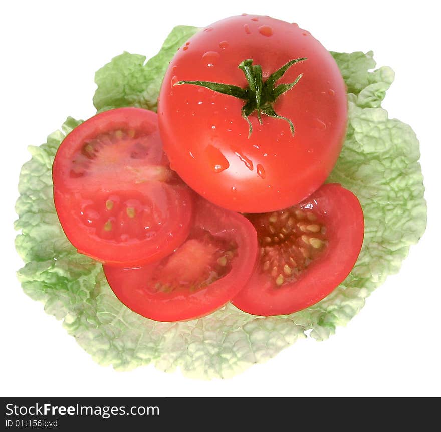 Tomato on salad leaf