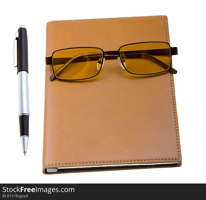 Electronic organizer with glasses and pen on white