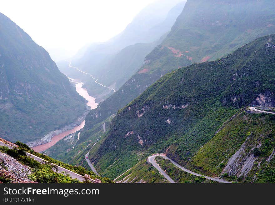 Mountain road through valley, Tibet, China