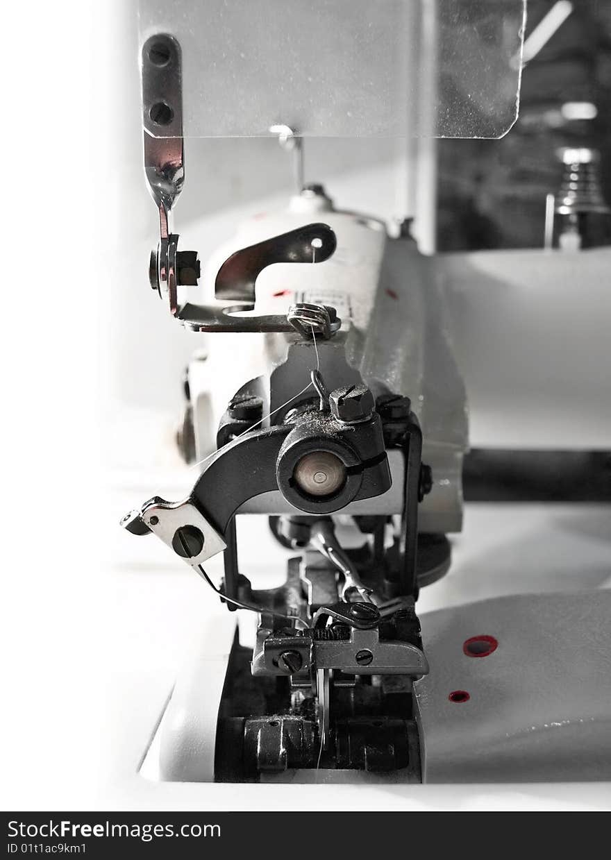 The over-stitching machine, close up