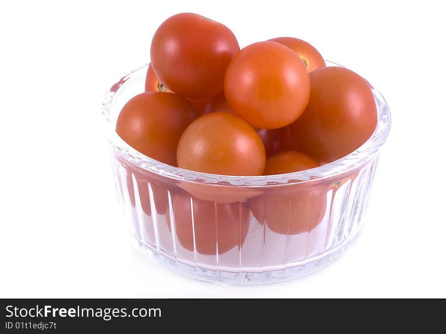 Little glass bowl with cherry tomatoes, isolated on white. Little glass bowl with cherry tomatoes, isolated on white.