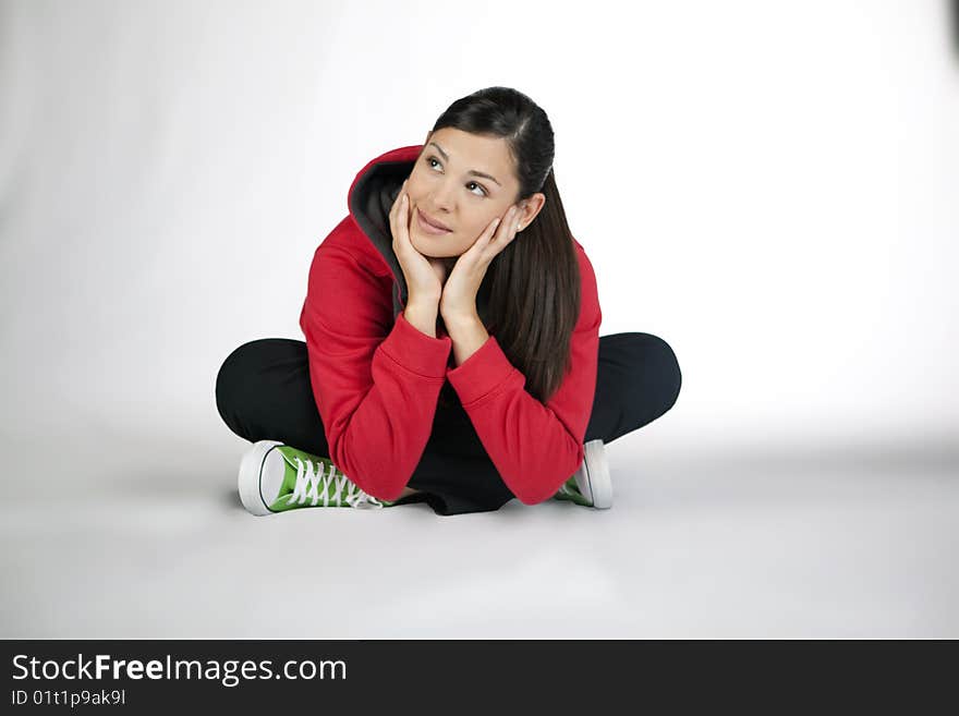 Cross-legged young woman dressed casual. Cross-legged young woman dressed casual