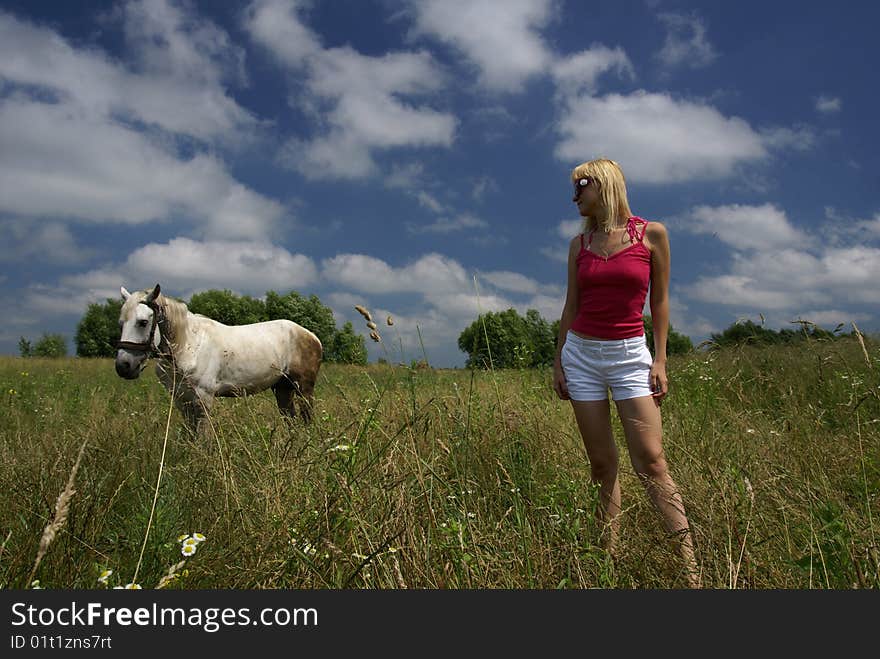 Beautiful young girl and horse