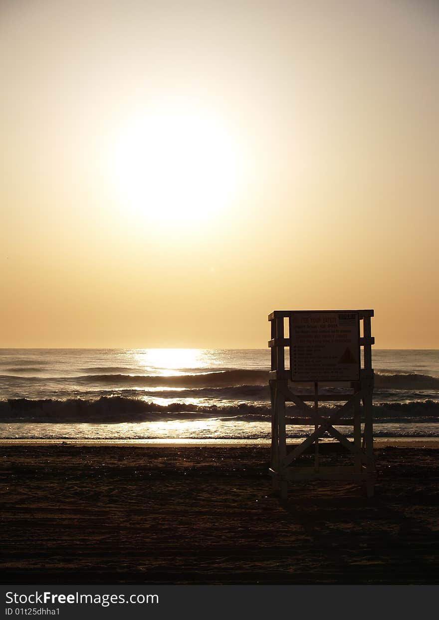 Empty lifegaurd chair at sunrise in Virginia Beach. Empty lifegaurd chair at sunrise in Virginia Beach