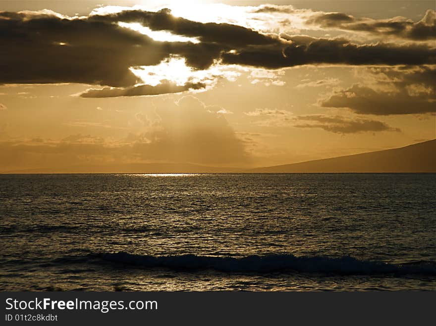 Light reflecting through the clouds onto the ocean. Light reflecting through the clouds onto the ocean