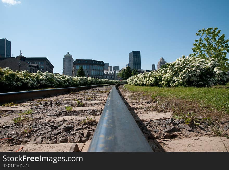 A railroad with Montreal buildings in the background. A railroad with Montreal buildings in the background