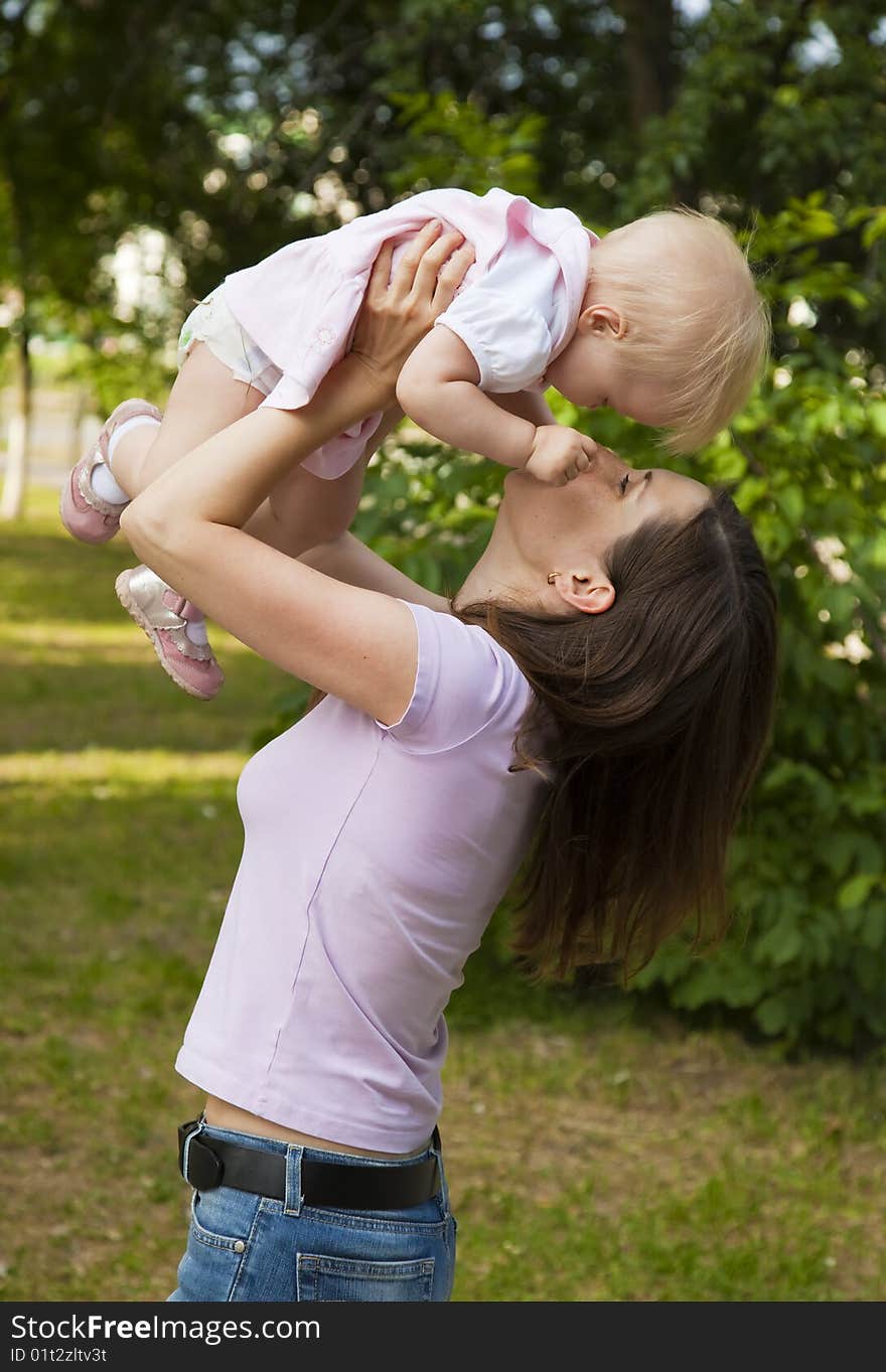 Woman holding her one year old daughter. Woman holding her one year old daughter