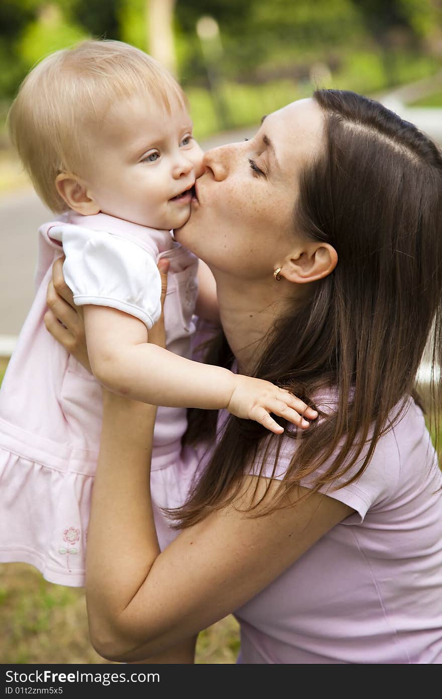 Woman holding her one year old daughter. Woman holding her one year old daughter