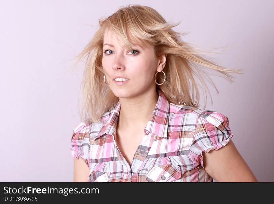 Happy blonde woman over background. Happy blonde woman over background