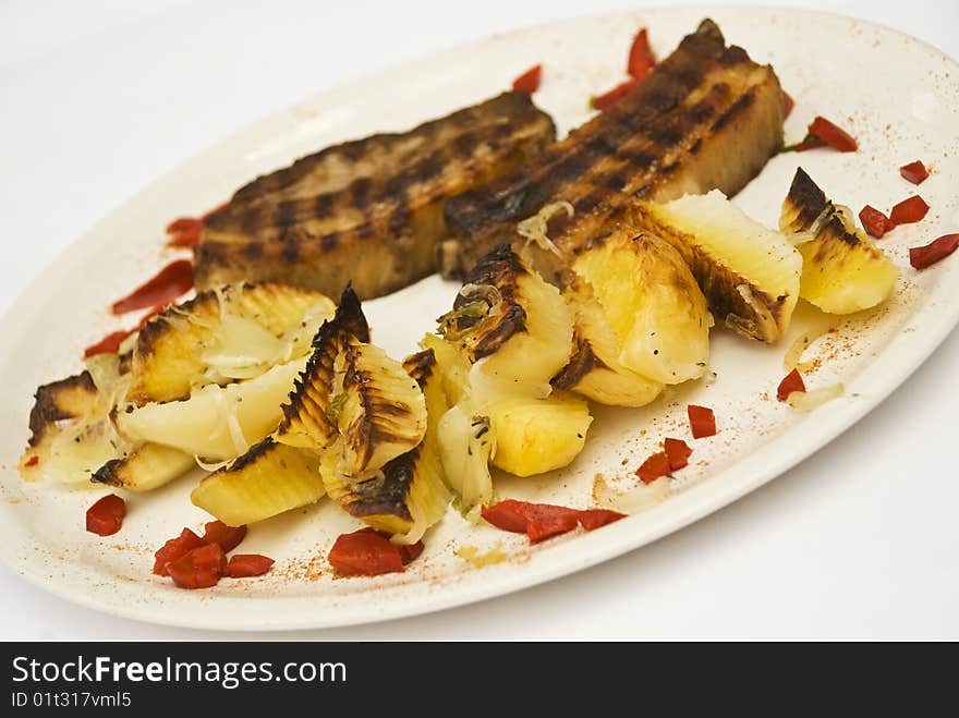 Roasted pork with rustic potato on a white plate decorated with bell pepper,see more in <a href=http://www.dreamstime.com/restaurant-food-rcollection10721-resi828293>Restaurant food</a>