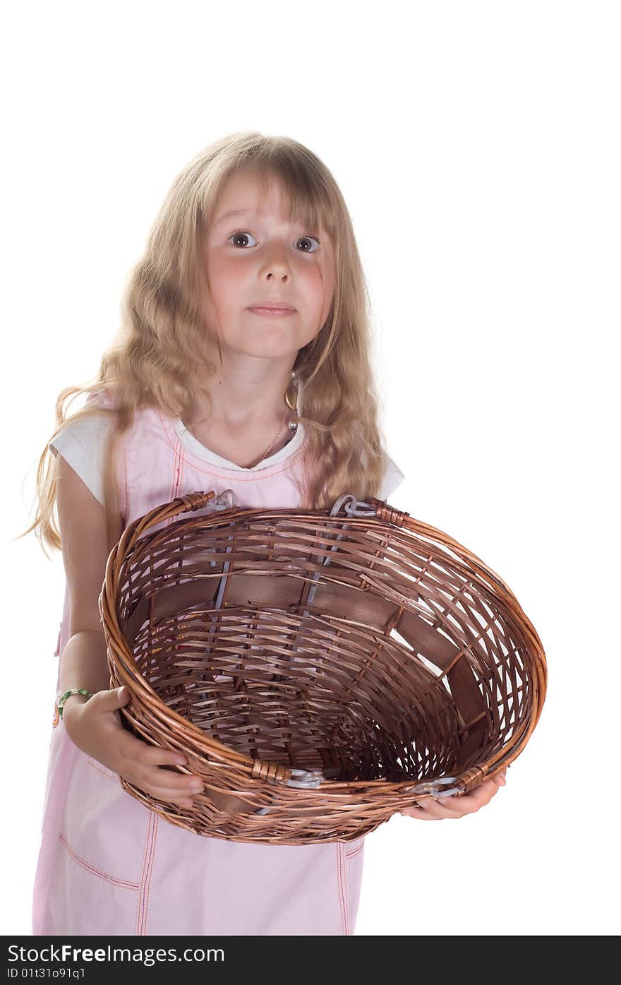 Shot of little girl playing with basket in studio