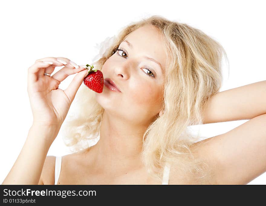 Young woman in white dress eating strawberries. Isolated on white background