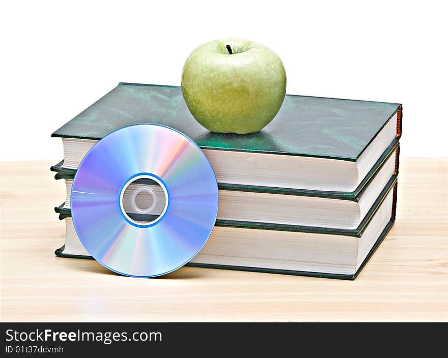 Apple, dvd, and books as a symbol of transition fron old to new mways of learning