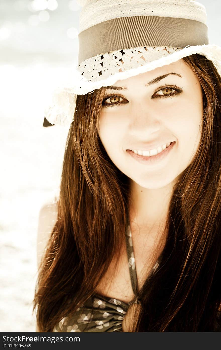 Young smiling woman staring at camera.