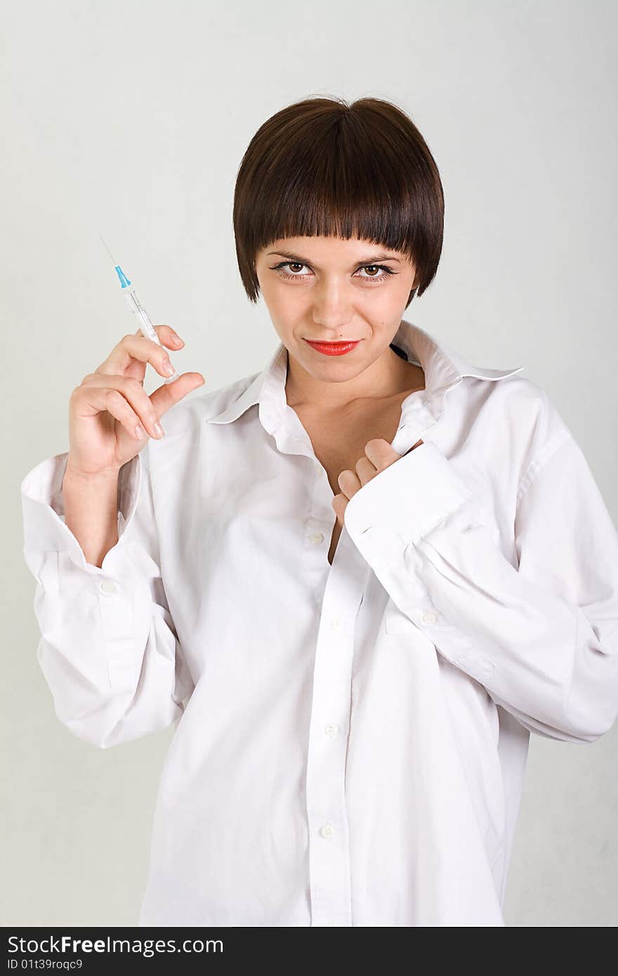 Portrait of a beautiful young girl nurse with syri