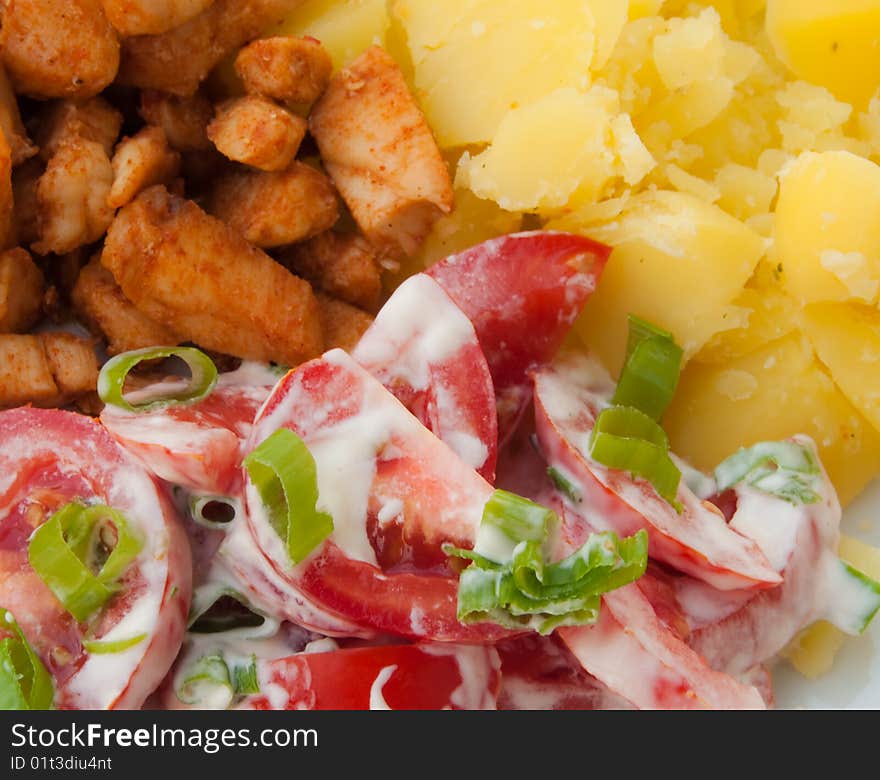 Meat, tomatoe with mayonnaise, onion and potato on a basin. Meat, tomatoe with mayonnaise, onion and potato on a basin