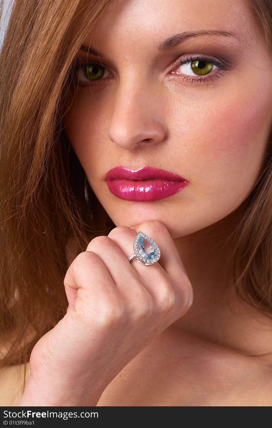 Portrait of a young beautiful brunettes, with a ring on the finger. Portrait of a young beautiful brunettes, with a ring on the finger