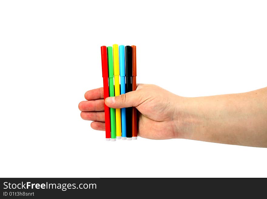 Man holds colour felt-tip pens in a hand