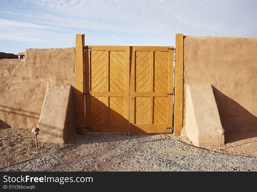 Wood gate and  brown fence. Wood gate and  brown fence