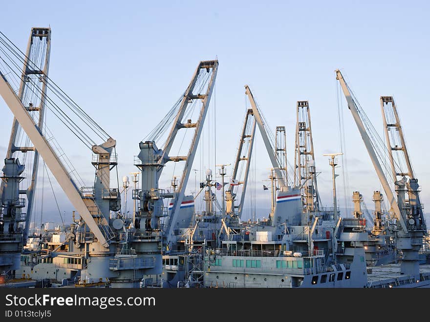 Cranes in dockside - perspective against blue sky