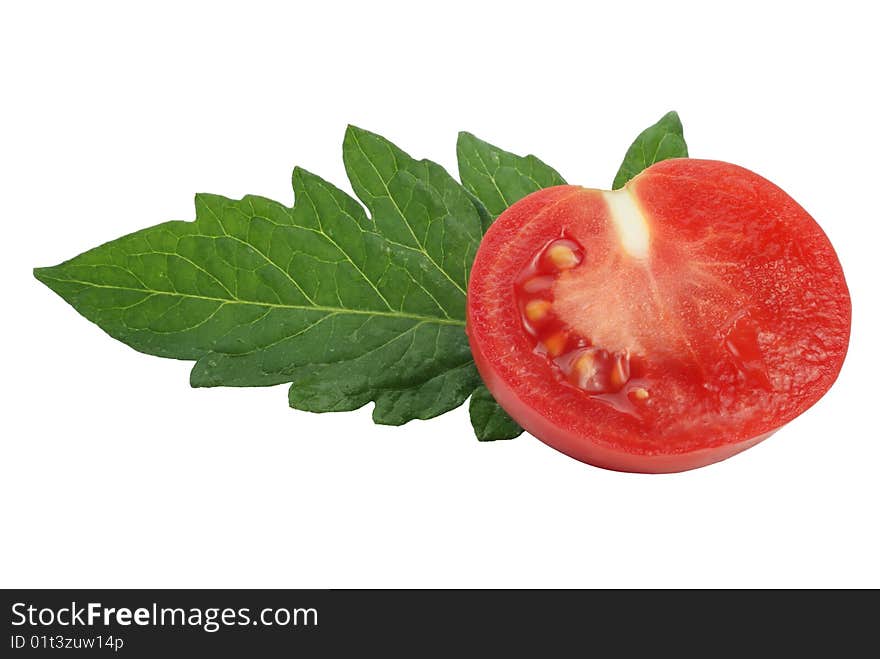 Slice of tomato and tomato leaf on white background. Slice of tomato and tomato leaf on white background