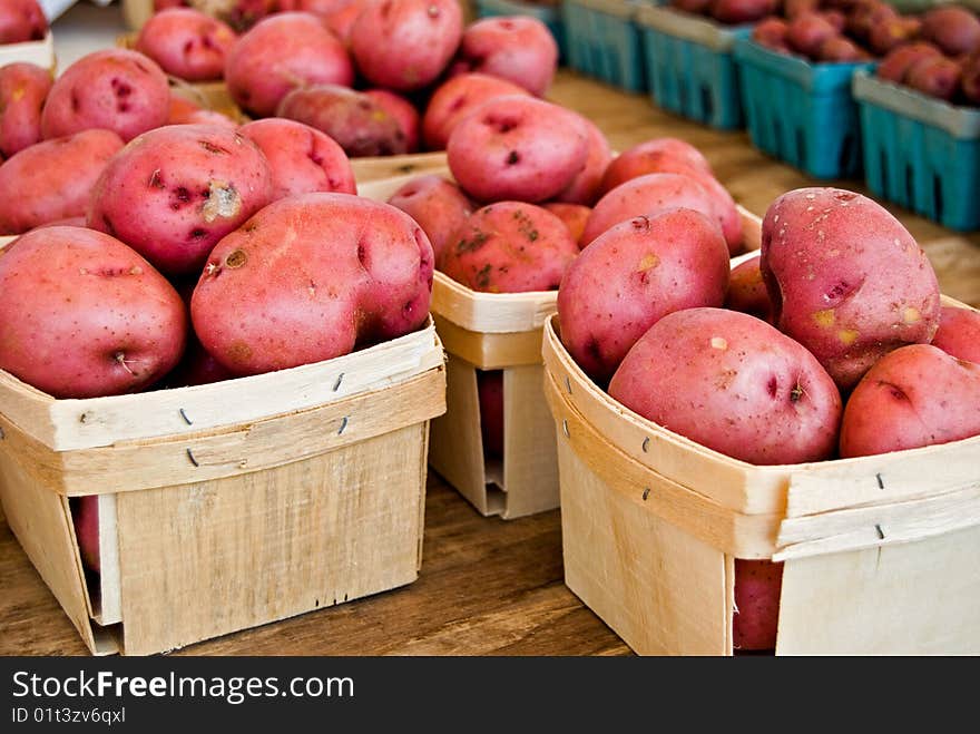 Red potatoes being sold at the farmer's market. Red potatoes being sold at the farmer's market.